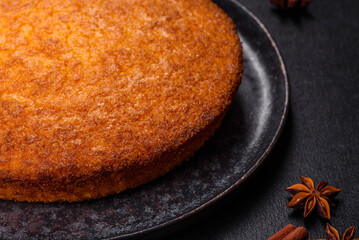 Pumpkin pie on marble cutting board. Dark background. Copy space