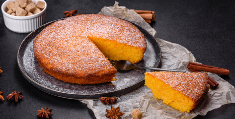 Pumpkin pie on marble cutting board. Dark background. Copy space