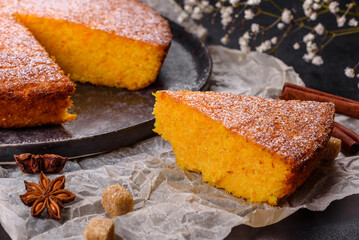 Pumpkin pie on marble cutting board. Dark background. Copy space