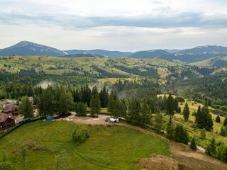 Green mountains of Ukrainian Carpathians in summer. Aerial drone view.