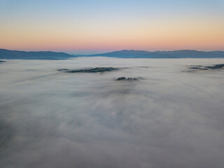 Morning fog in the Ukrainian Carpathians. Aerial drone view.