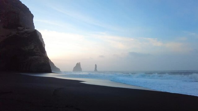 The black sand beach of Reynisfjara and the mount Reynisfjall from the Dyrholaey promontory in the southern coast of Iceland.
Location: Reynisfjara Beach, Vik Village, Iceland (Sudurland), Europe
