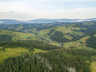 Obraz premium Green mountains of Ukrainian Carpathians in summer. Aerial drone view.