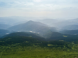 Fototapeta na wymiar High mountains of the Ukrainian Carpathians in cloudy weather. Aerial drone view.