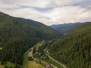Fototapeta premium Green mountains of Ukrainian Carpathians in summer. Aerial drone view.