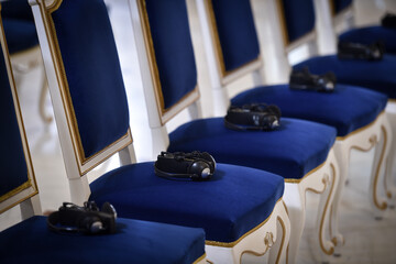 Headphones are seen on elegant chairs before the start of a conference