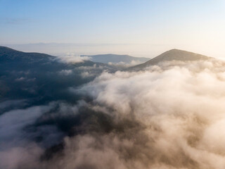 Morning fog in the Ukrainian Carpathians. Aerial drone view.