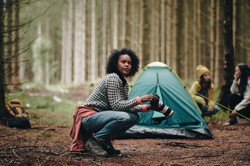 Woman taking photos during a camping trip