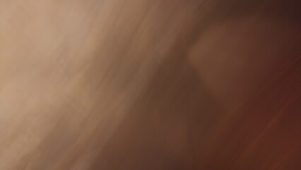 Abstract blur background with gray-brown, black, white, red and earth tones.