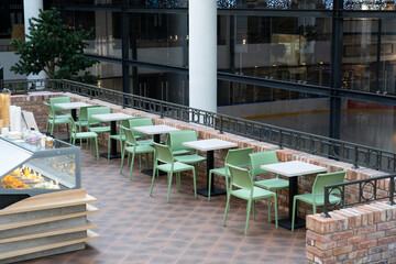 Interior of wooden table in food court shopping mall.