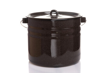 a large household metal pan of brown color with a lid on a white isolated background