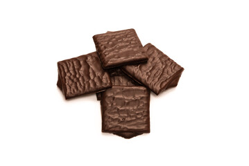 Dark chocolate candies isolated on white background.