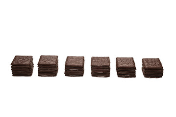 Dark chocolate candies isolated on white background.