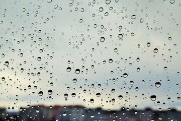 a drop of water on the glass in a chaotic manner