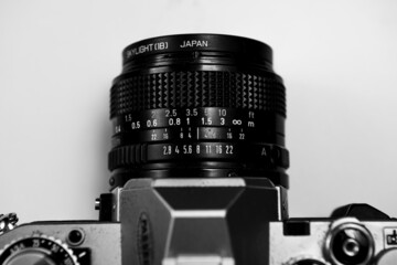 traditional 35 mm film camera focus on the lens, 28mm with the focus ring and aperture, classic and...