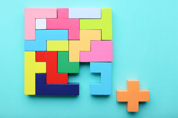 Multicolored puzzle, cubes on a blue background