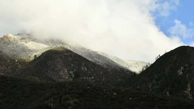 Cold Front Forms Snowline in High Mountain Pass