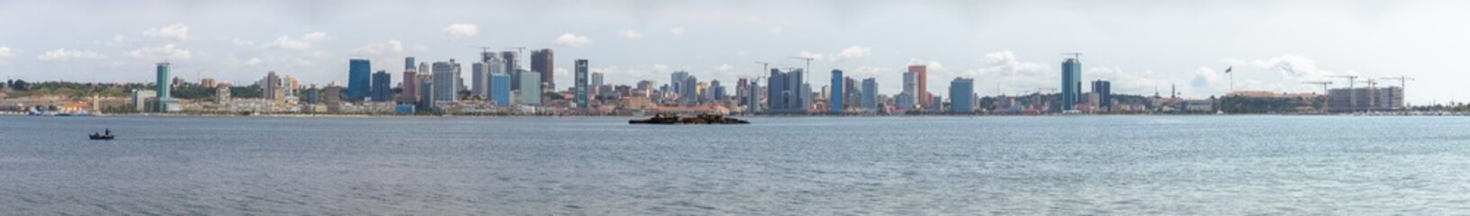Naklejka premium Panoramic view at the Luanda city downtown, Modern skyscrapers buildings, bay, Port of Luanda, marginal and central buildings, bay water, Angola