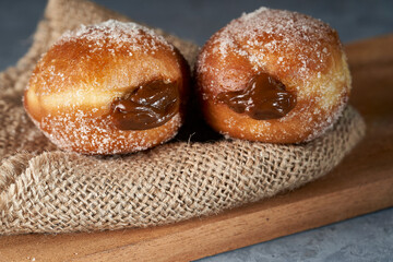 two Berliners stuffed with dulce de leche.