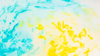 Yellow-blue fluid art background. Spots in the colors of the Ukrainian flag. Blurred colorful background