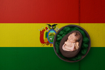 Newborn portrait on background in color of national flag. Patriotic photography concept. Bolivia