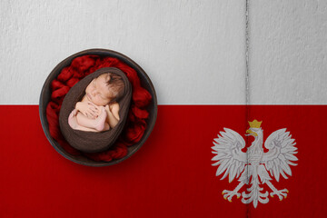 Newborn portrait on background in color of national flag. Patriotic photography concept. Poland
