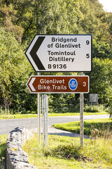 Sign for Glenlivet Bike Trails and Tomintoul Distillery at Bridge of Avon, near Tomintoul, Moray,...