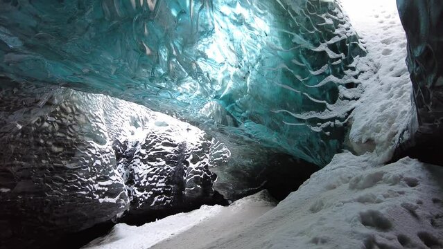 Ice Cave in Vatnajokull, Iceland.The beauty of the caves filled with blue ice. 