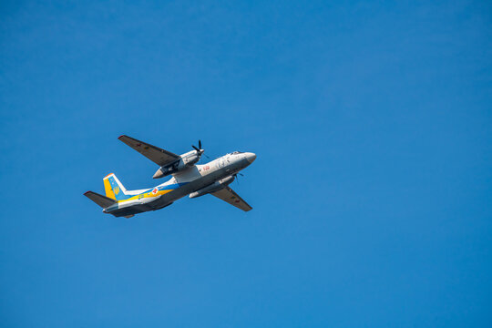 An-26 Antonov aircraft for medical service of ukrainian army flying  in blue sky under the Kiev during the parade on the occasion of 30 years of independence of Ukraine, august 2021