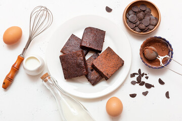 Slices of brownie dessert on a light background
