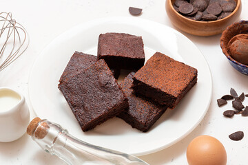 Slices of brownie dessert on a light background
