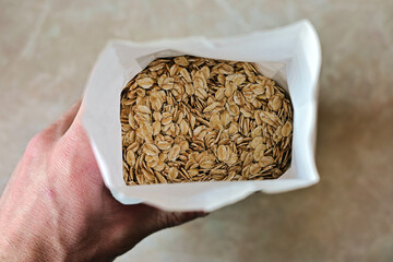 Oat flakes. Cereals for oatmeal and muesli. oats in a pack, top view.