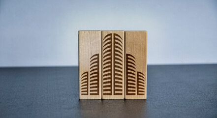 wooden cube, with a big city icon, building in the city