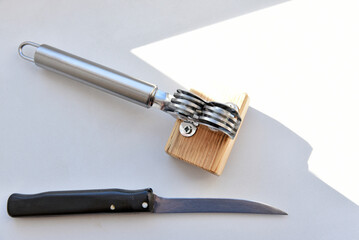 Sharpening an iron knife with a sharpener