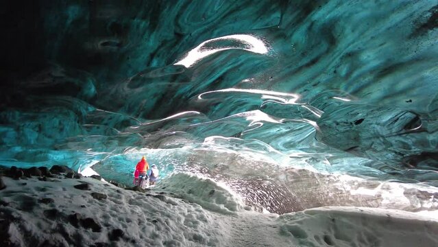 Ice Cave in Vatnajokull, Iceland.The beauty of the caves filled with blue ice. 