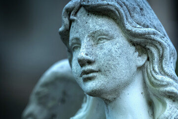 Beautiful angel as symbol of death, pain and end of human life. Fragment of an ancient statue