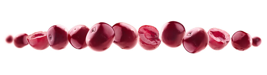 Red cherry berries levitate on a white background
