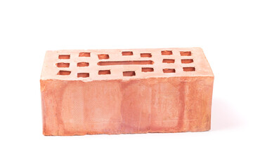 white background. the brick was made of clay. there are holes. close-up.