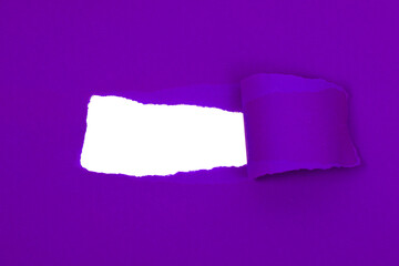 Violet crushed torn paper with hole copyspace background for idea