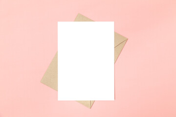 Obraz na płótnie Canvas Wedding invitation or greeting card mockup and craft paper envelope