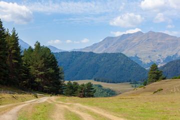 Fototapeta premium View in Mountains. Road to Shenako village from Diklo in Tusheti region