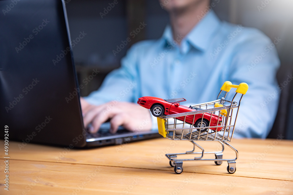 Poster man with computer and car in basket