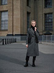 Obraz premium Street style and fashion photo. Fashion week, stylish look. girl in autumn jacket.
