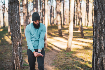 Fototapeta premium Man with beard enjoys exercising in nature.