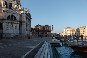 The square of the basilica Santa Maria Della Salute next to the grand canal of venice.