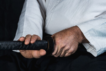 in the hands of the samurai, the sword is in the sheath