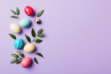 Colorful Easter eggs with spring flower leaf isolated over white background. Colored Egg Holiday border