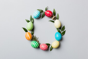 round frame Multi colors Easter eggs on colored background . Pastel color Easter eggs holiday concept with empty space for you design