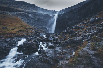 Fossa Waterfall on island Bordoy. This is the highest waterfall in the Faroe Islands, situated in wild scandinavian scenery. November 2021