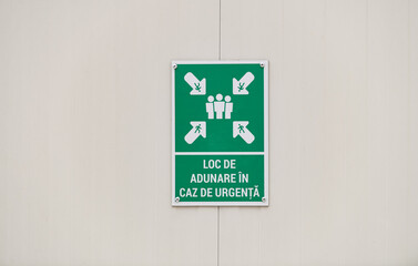 Emergency assembly point in Romanian language (loc adunare caz de urgenta) sign on a construction site